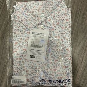 Rhoback “the ATX” golf shirt. Dri Fit and unworn in the original packaging.